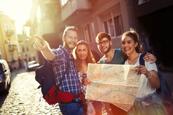 Happy tourists with map